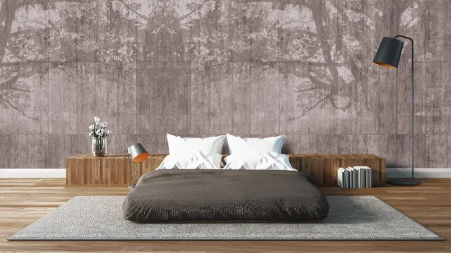 Arredamento con parete effetto cemento